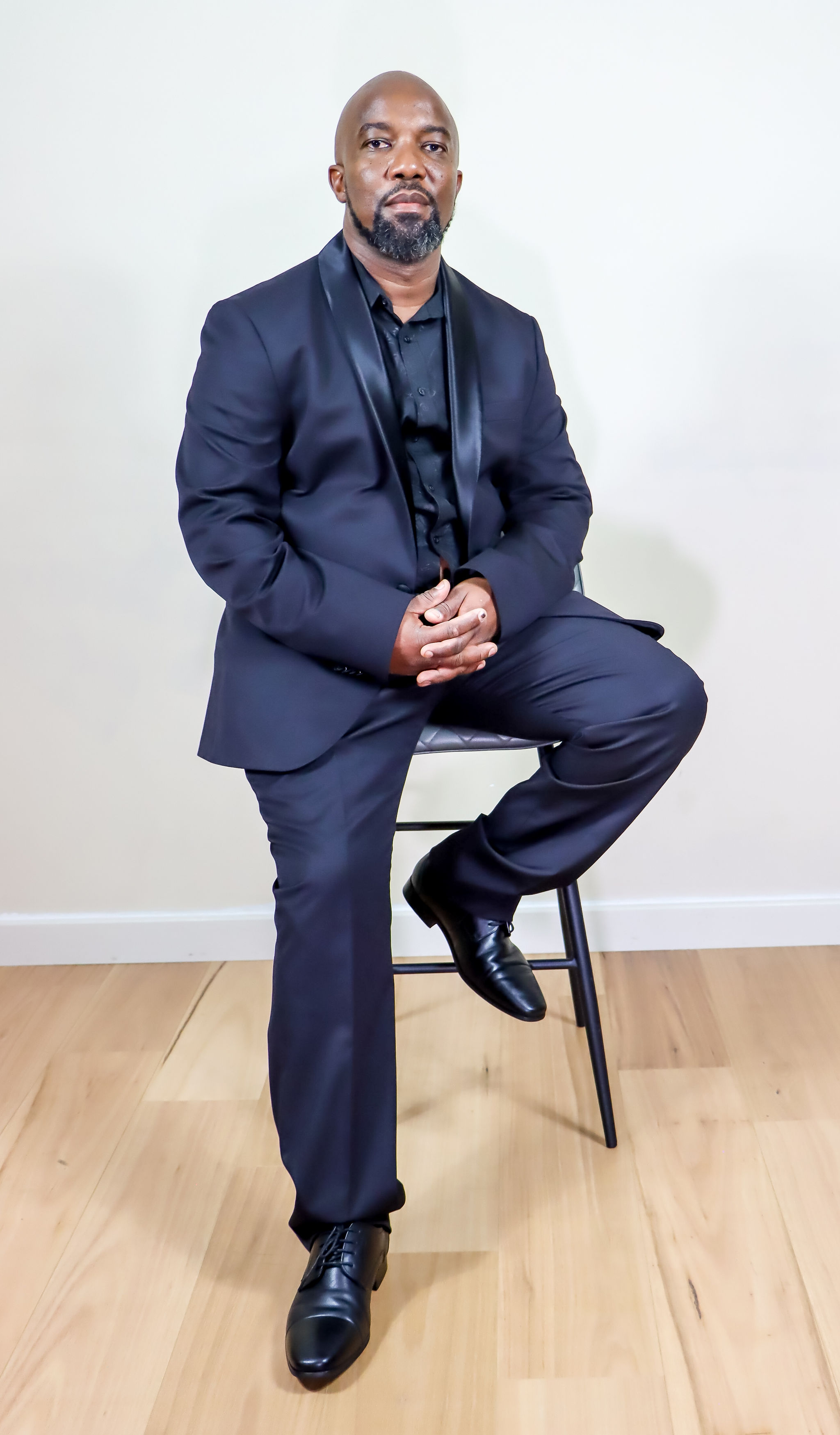 Ramson in a formal black suit